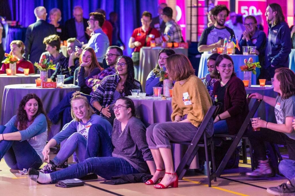People enjoying an event presentation.
