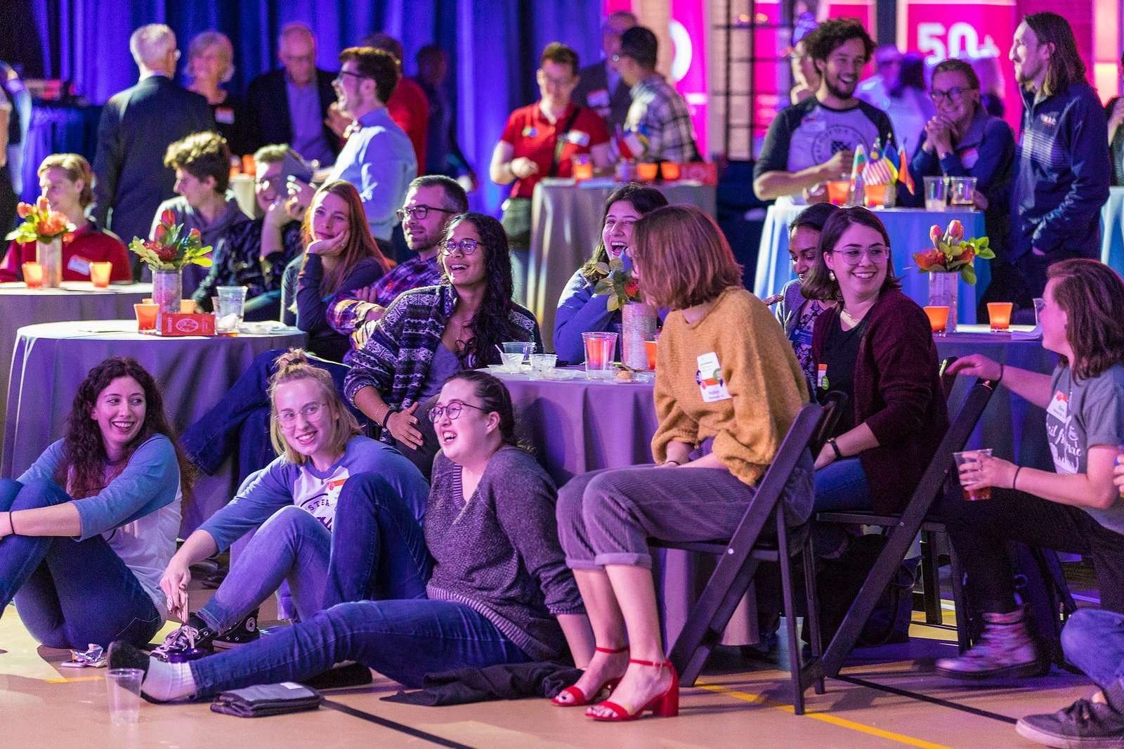 People enjoying an event presentation.